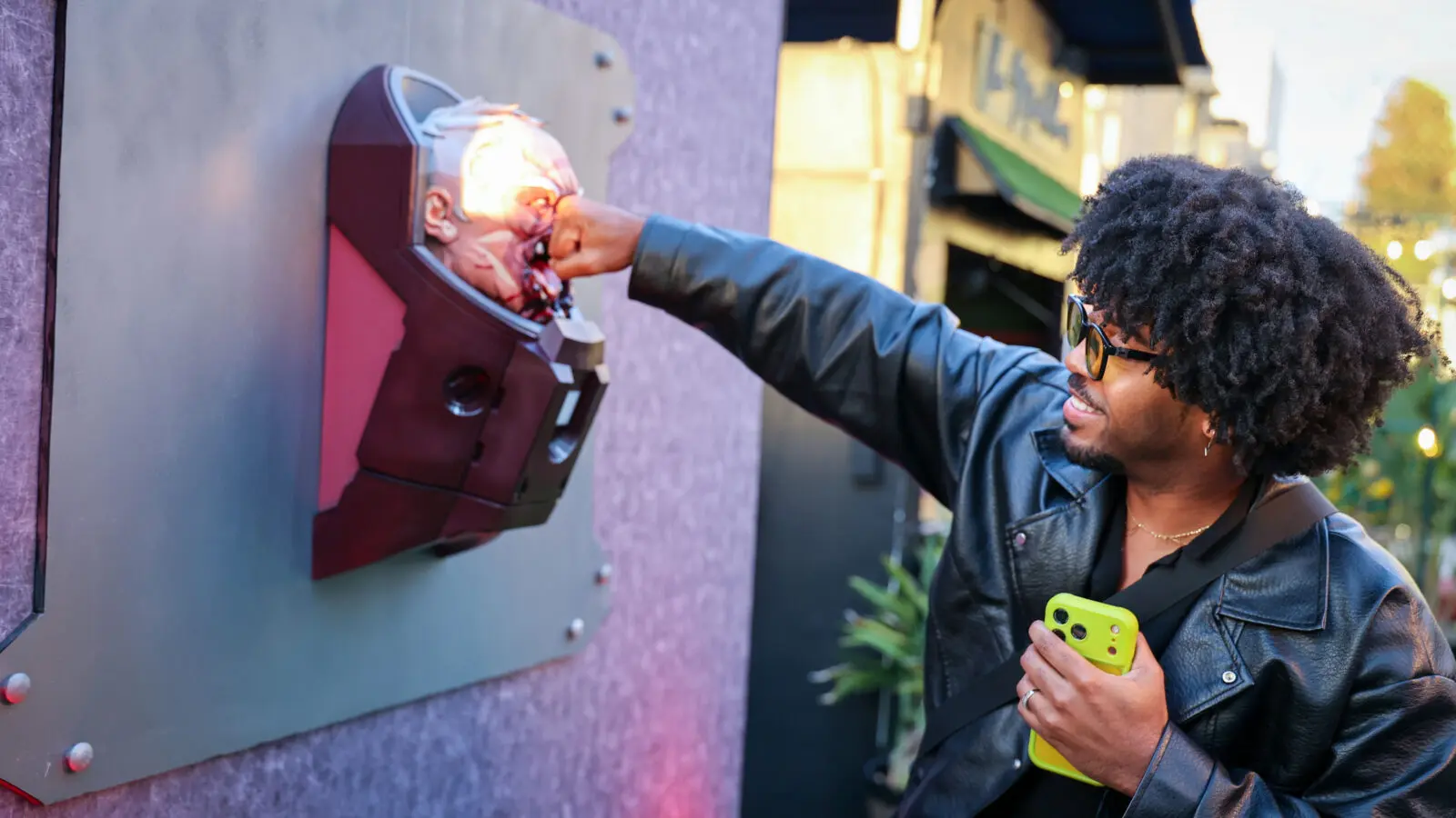 Creator @your.royal.freshness playfully punches a custom 3D-printed sculpture of the battle-damaged Invincible villain Conquest at Prime Video’s Season 4 creator event.