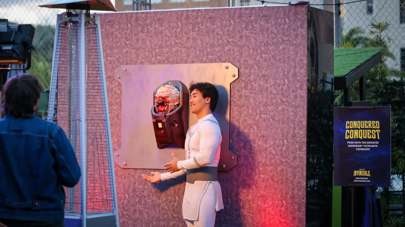Creator @justinsaiyann poses beside the custom 3D-printed “Conquered Conquest” installation at Prime Video’s Invincible Season 4 creator event.