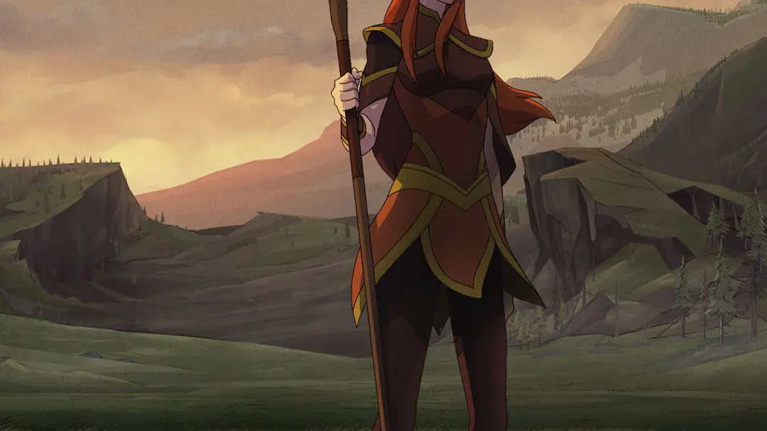 Keyleth standing in a grassy plain at dusk, holding a staff with a glowing green crystal, silhouetted foreground grass and distant rocky hills under a cloudy sunset.