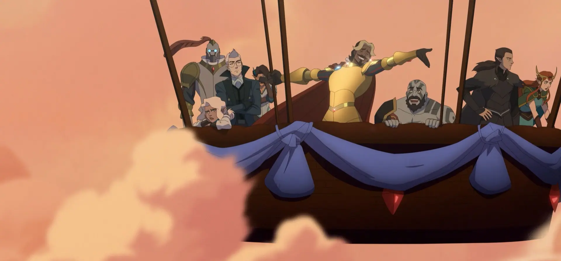 Members of Vox Machina lean over a decorated airship gondola railing, silhouetted against a warm pink-orange sky with clouds drifting below.