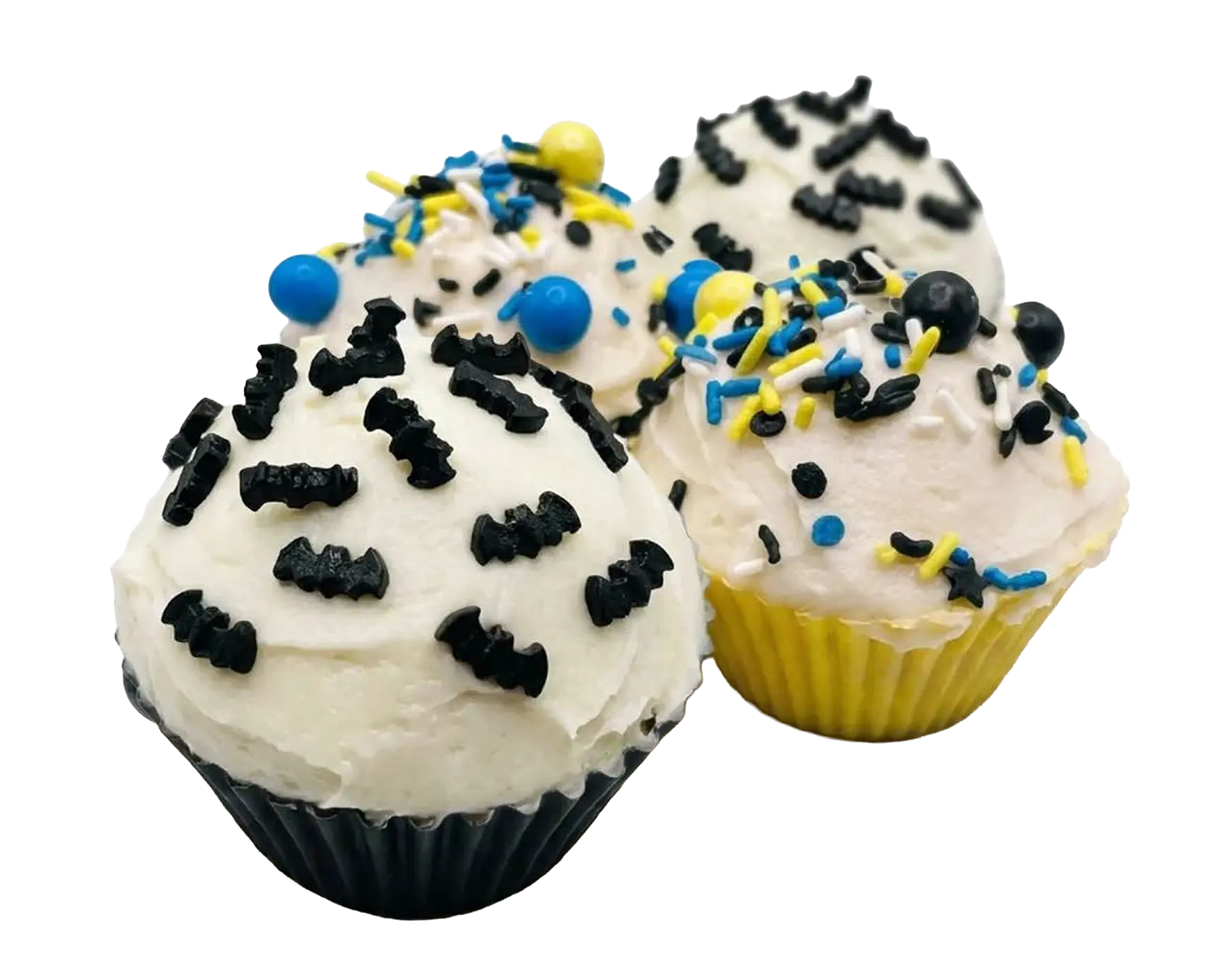 Three cupcakes with white buttercream, black bat-shaped sprinkles, and blue, yellow, and white round sprinkles in black and yellow paper liners.