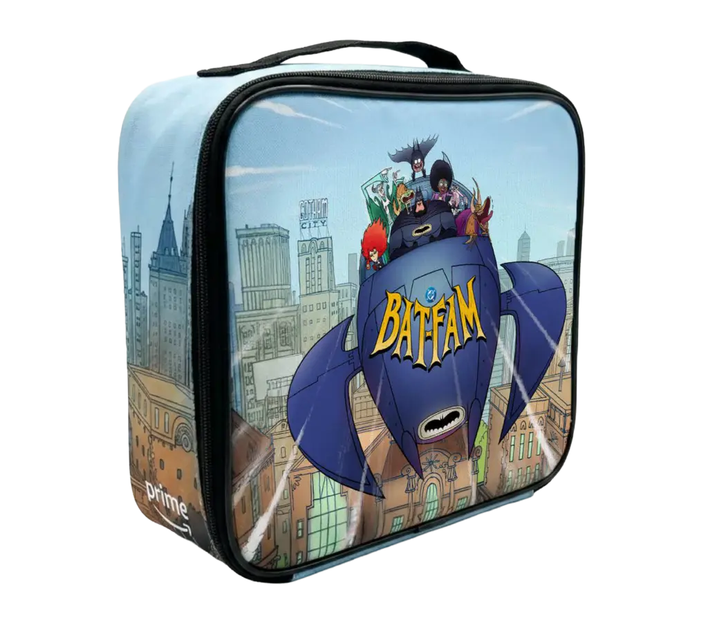 Glossy zippered lunch box showing the Bat‑Fam characters riding a stylized blue Batboat over a cartoon Gotham skyline, with a bold yellow Bat‑Fam logo on the boat's nose.