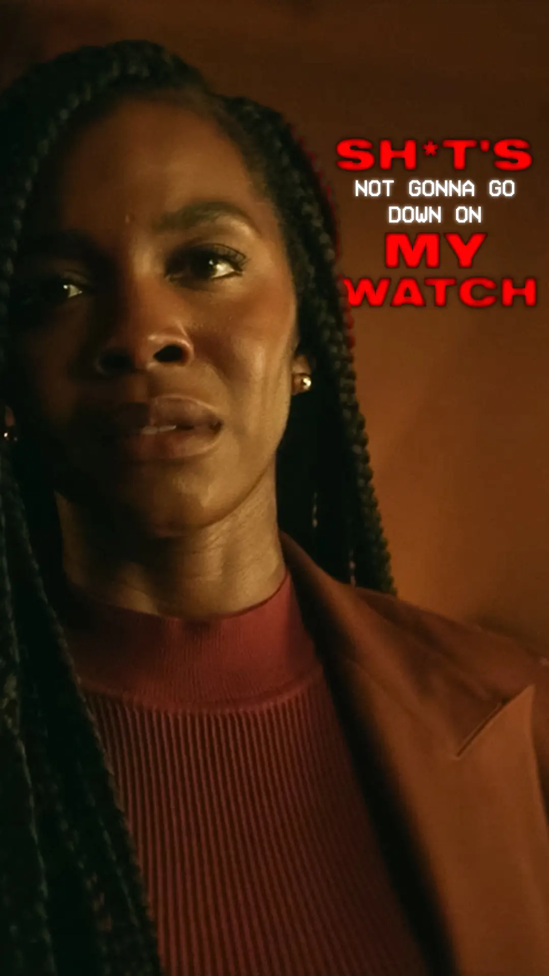 Detective Dawn Reeve in a tight vertical close-up, warm brown background, braided hair and red sweater, with bold red-and-white text saying 'SH*T'S NOT GONNA GO DOWN ON MY WATCH'.