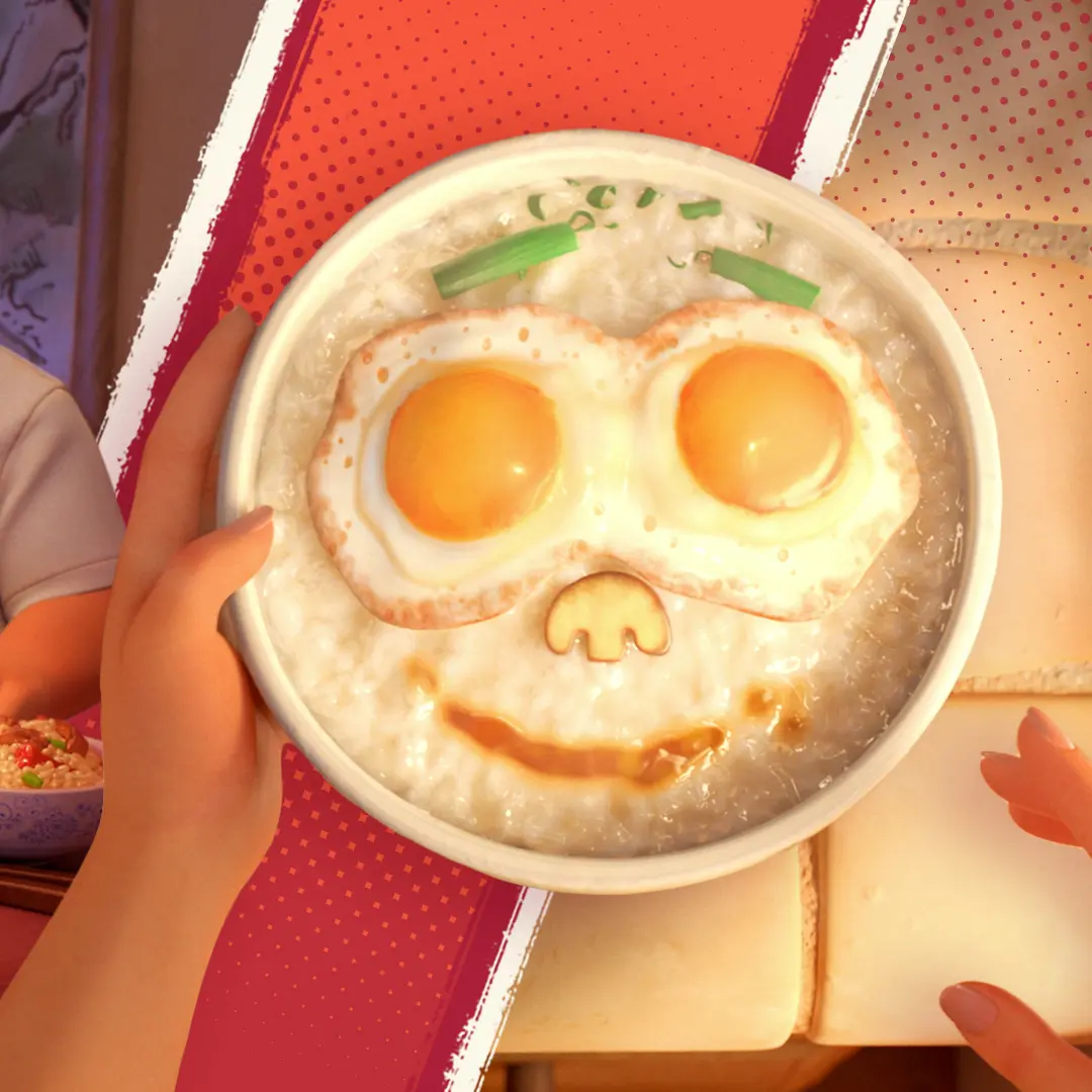 Hands hold a bowl of creamy rice porridge topped with two sunny-side-up eggs, scallion 'eyebrows', a mushroom-shaped nose, and a soy-sauce smile arranged like a playful face.