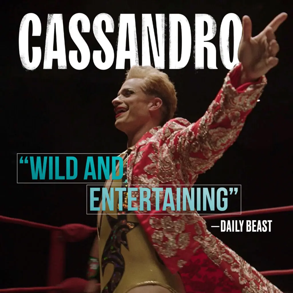 Cassandro stands in a wrestling ring wearing an ornate pink robe as a Daily Beast “Wild and Entertaining” review quote appears over the image.