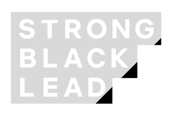 Strong Black Lead wordmark in white stepped lettering within a light gray rectangular field, with black corner cuts shaping the mark’s compact silhouette.